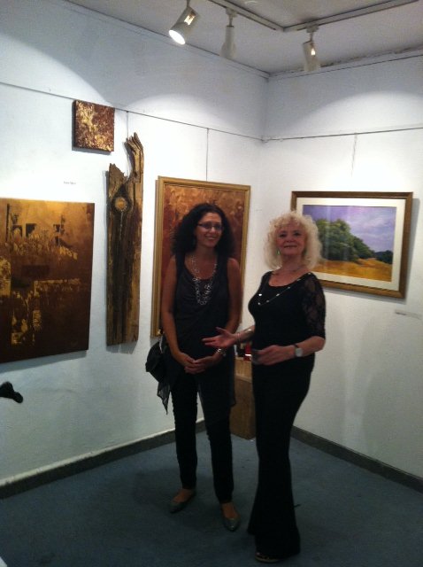 Einat with the gallery owner